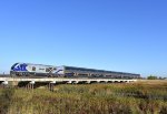 Amtrak Capitol Corridor Train # 528, being pushed by SC-44 # 2105, races across the Guadalupe River bridge about a minute after departing Santa Clara/Great America Station